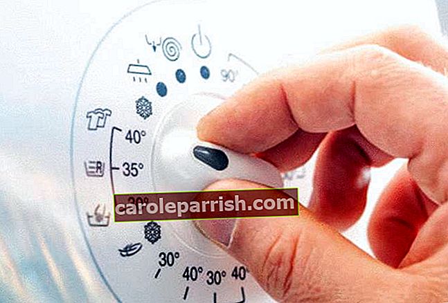Mensch-Hand-Drehen-der-Temperatur-Knopf-der-Waschmaschine